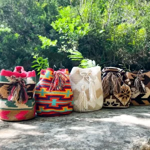 Colorful Wayuu medicine bags with intricate patterns and tassels